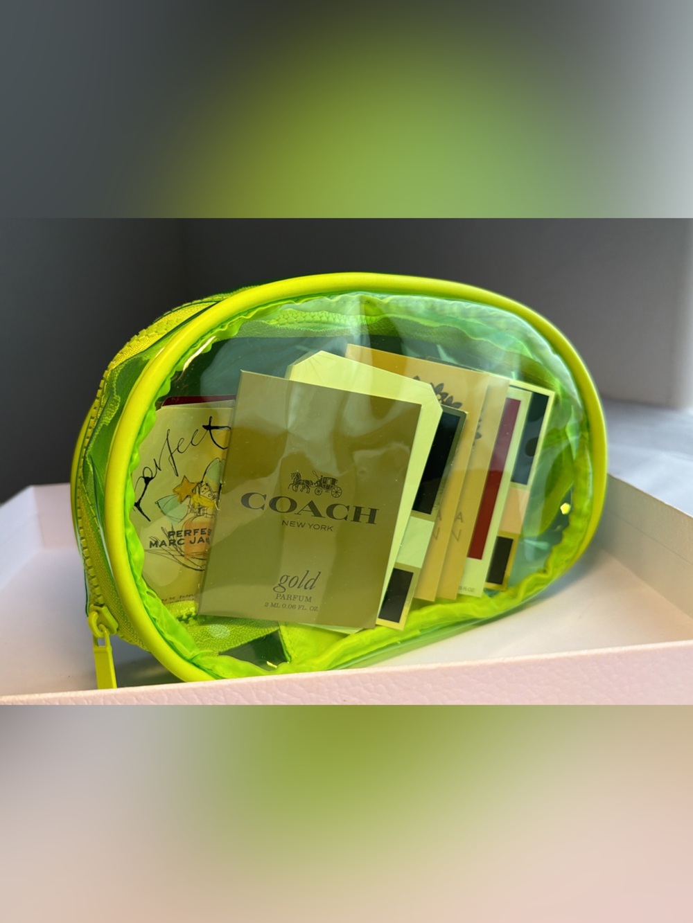 New,unused & authentic Green Transparent Makeup Pouch with Perfumeee3 Sample Set